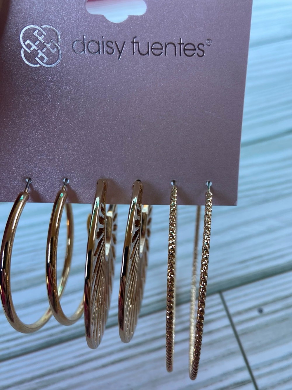 NEW Daisy Fuentes gold tone hoop earring set.